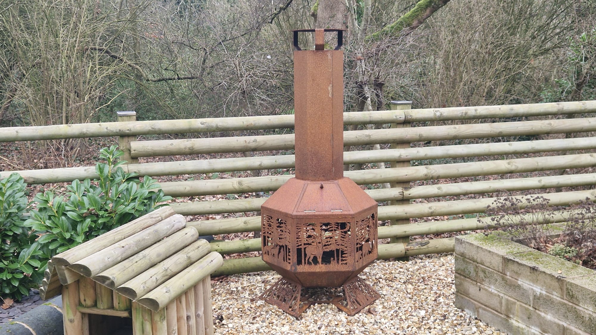 Corten steel outdoor fire feature in a garden